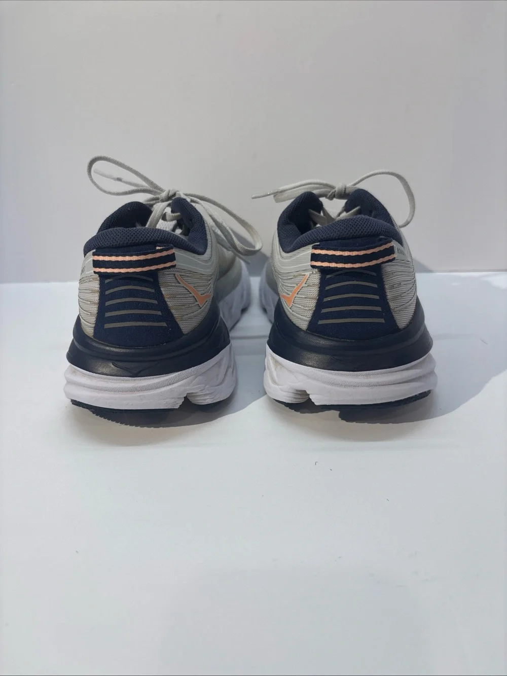 Hoka women’s size 7 gray/peach Bindi 7 style #110531 LRBI in fair condition.